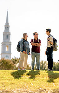 dallas faculty member and student talking outside
